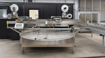 Crea-Tech labelling machine for flower sleeves